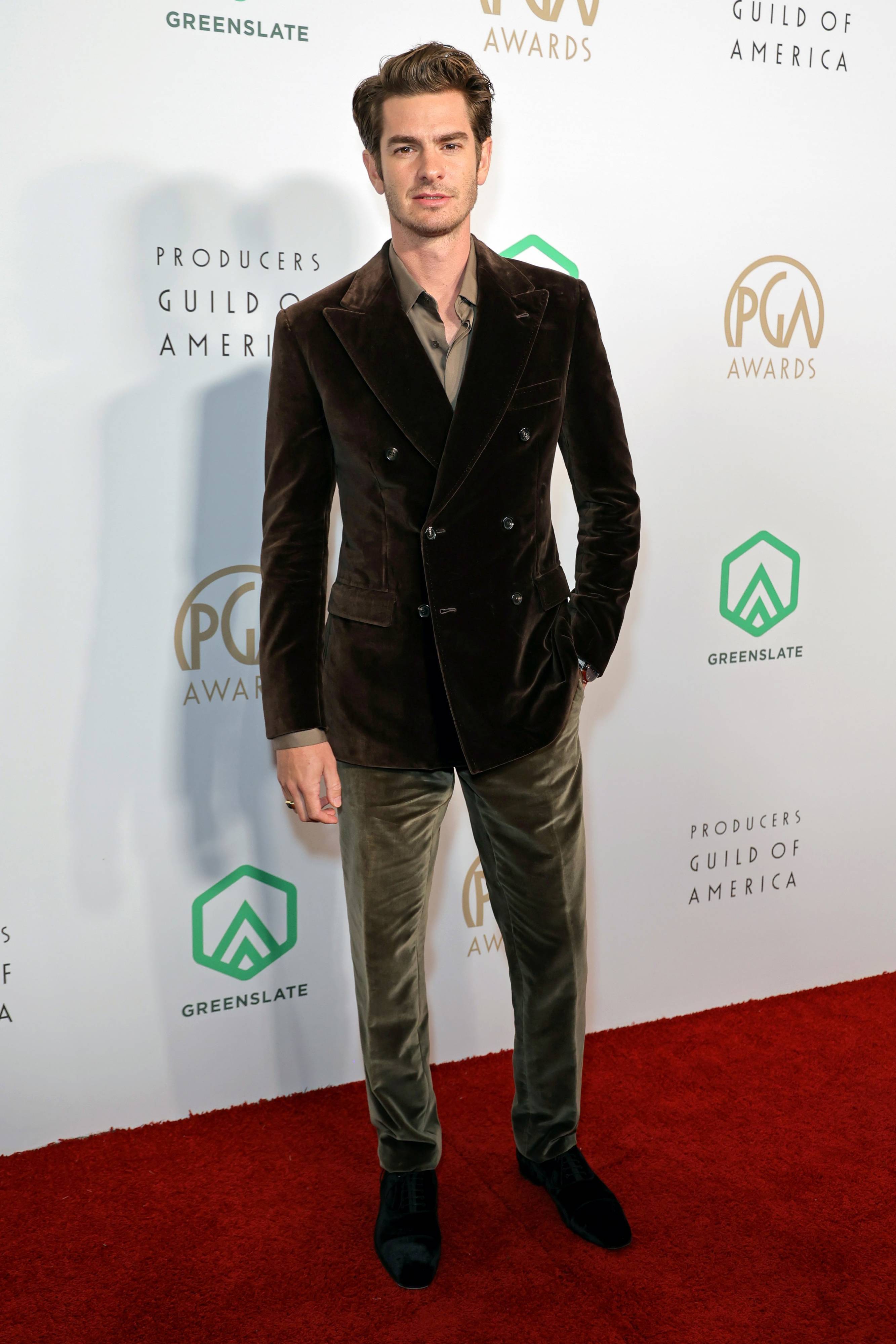 Andrew Garfield wearing a Brioni green suit