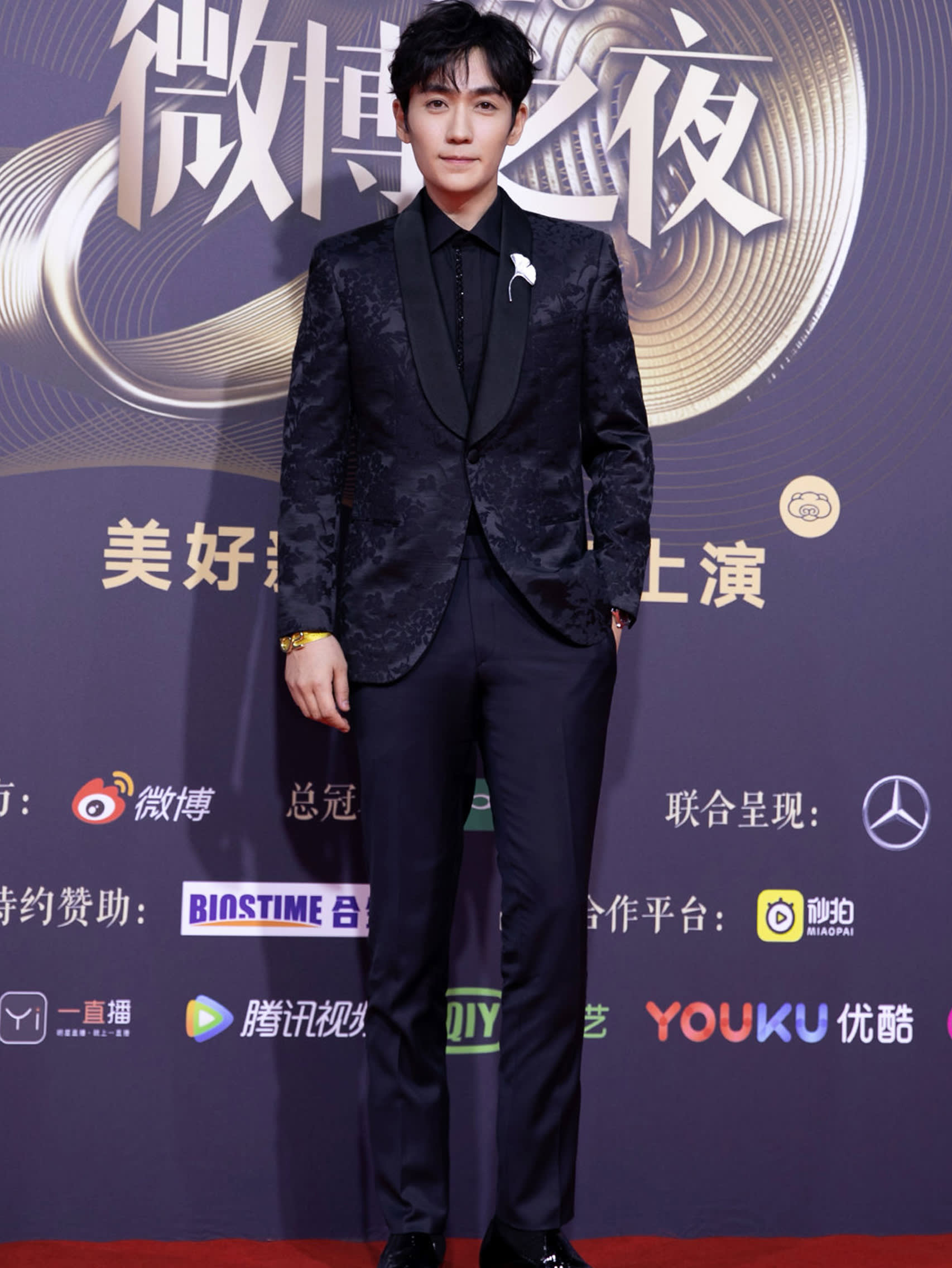 Zhu Yilong wearing a Brioni bespoke black tuxedo