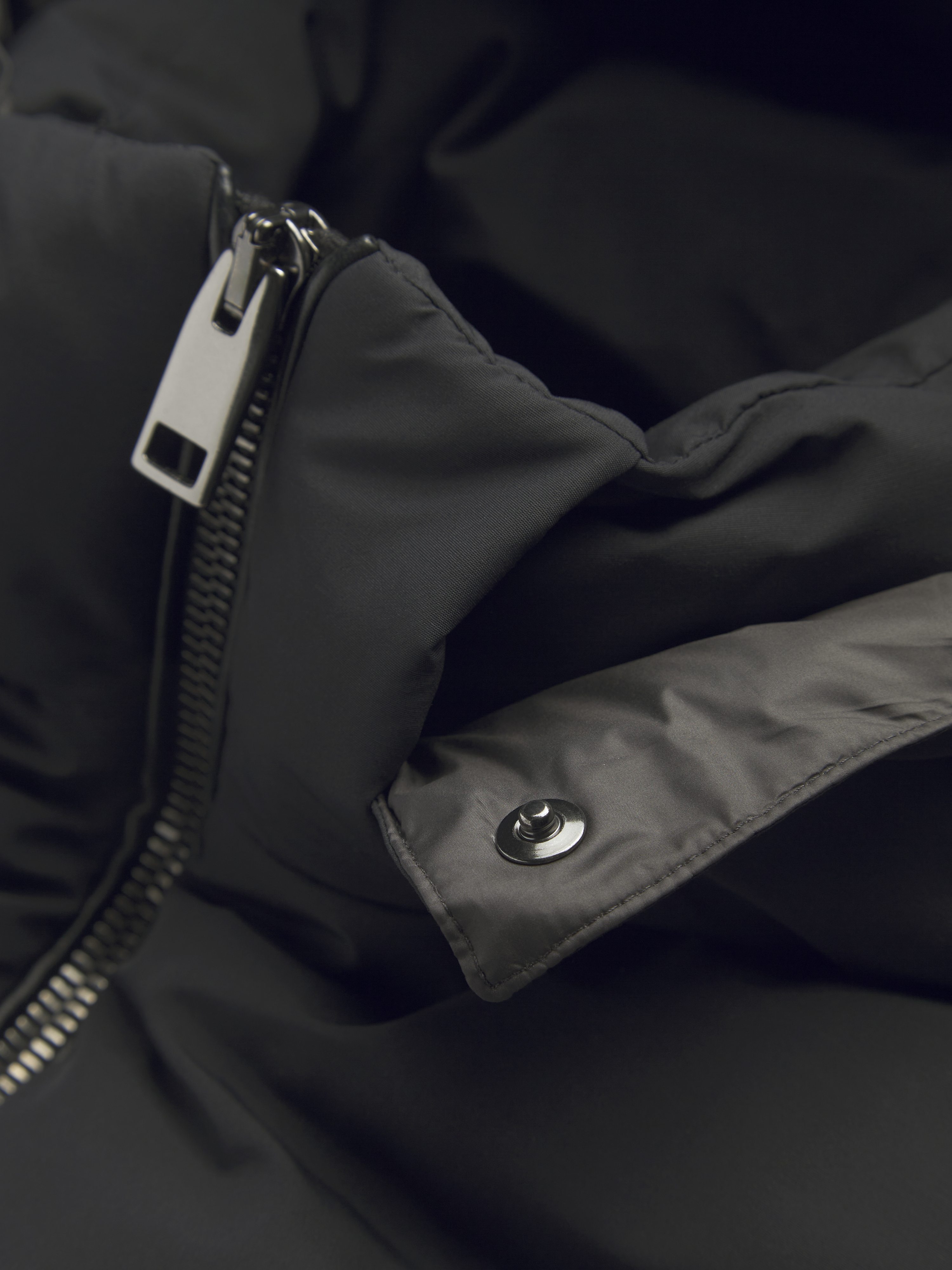Black quilted and padded vest in technical wool