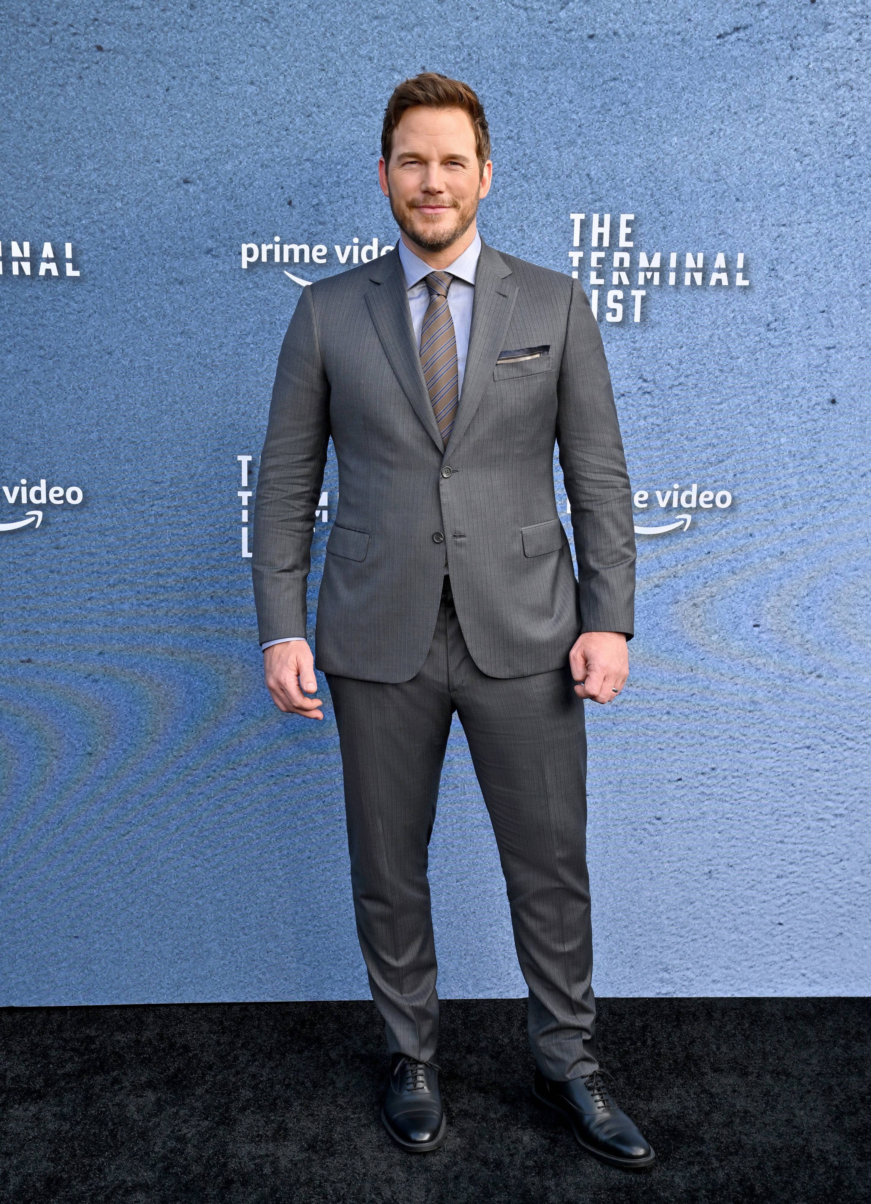 Chris Pratt wearing a Brioni grey suit