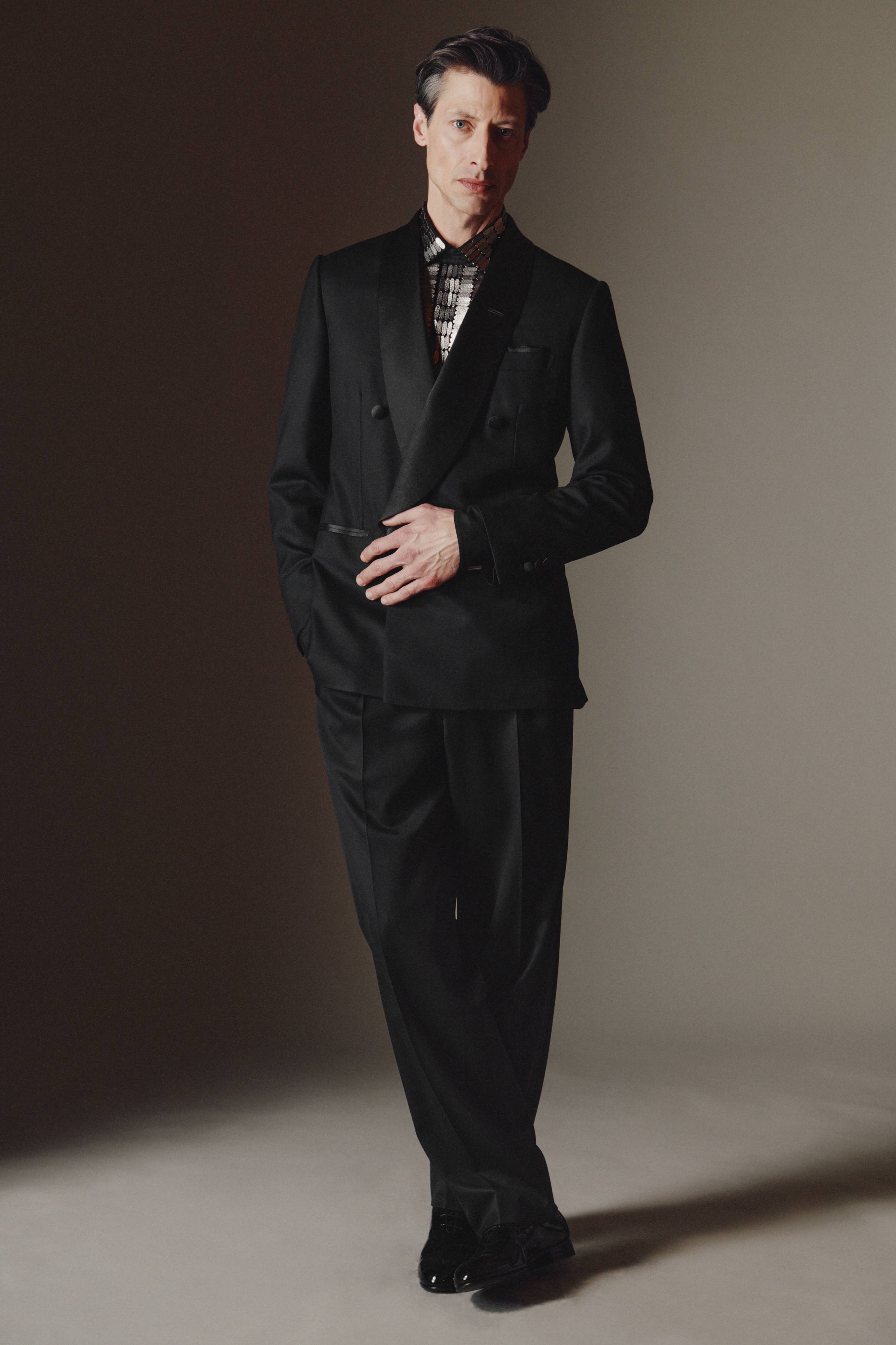 Brioni model wearing black tuxedo from fall winter 22