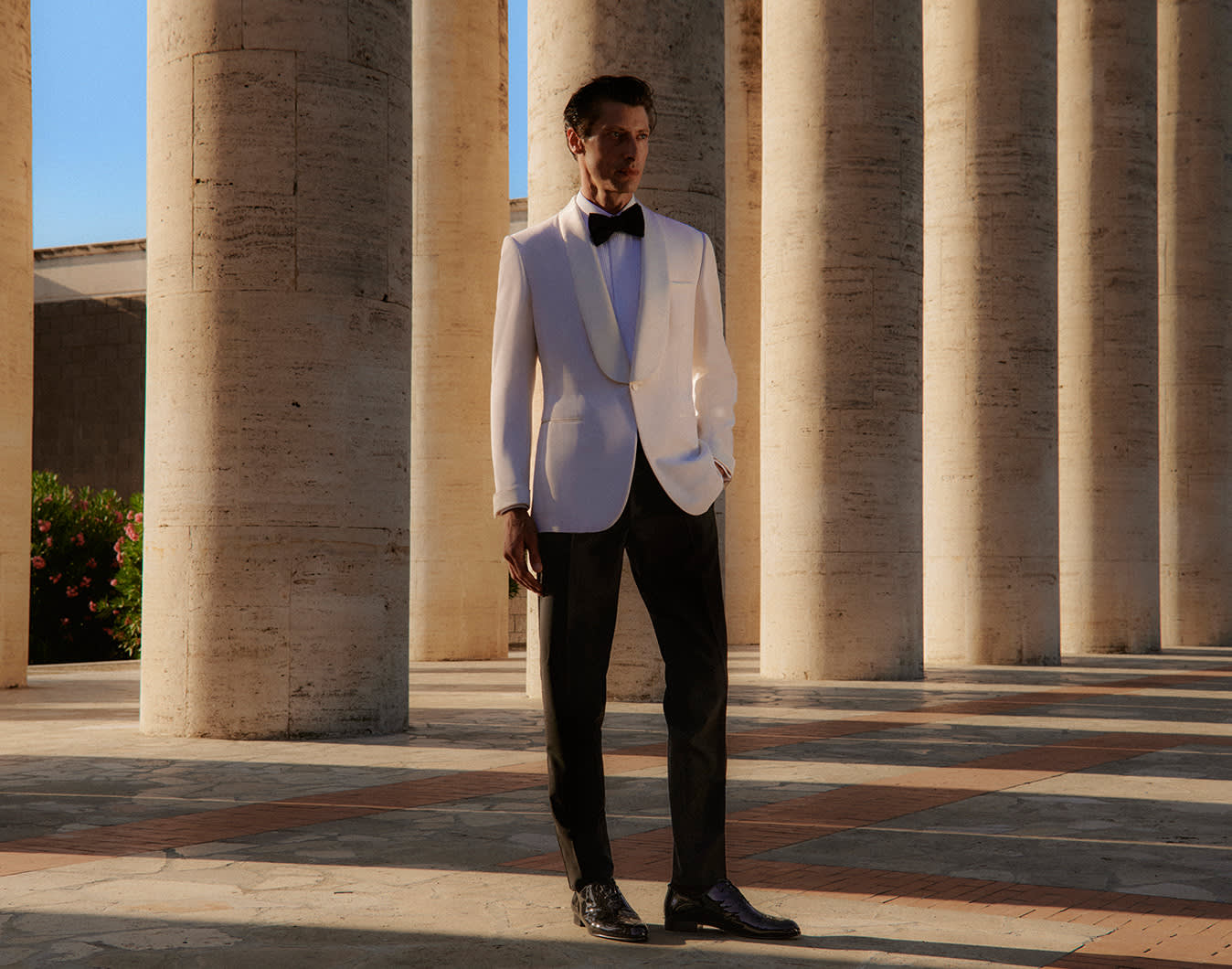 Brioni model wearing a white tuxedo from the SS23 collection