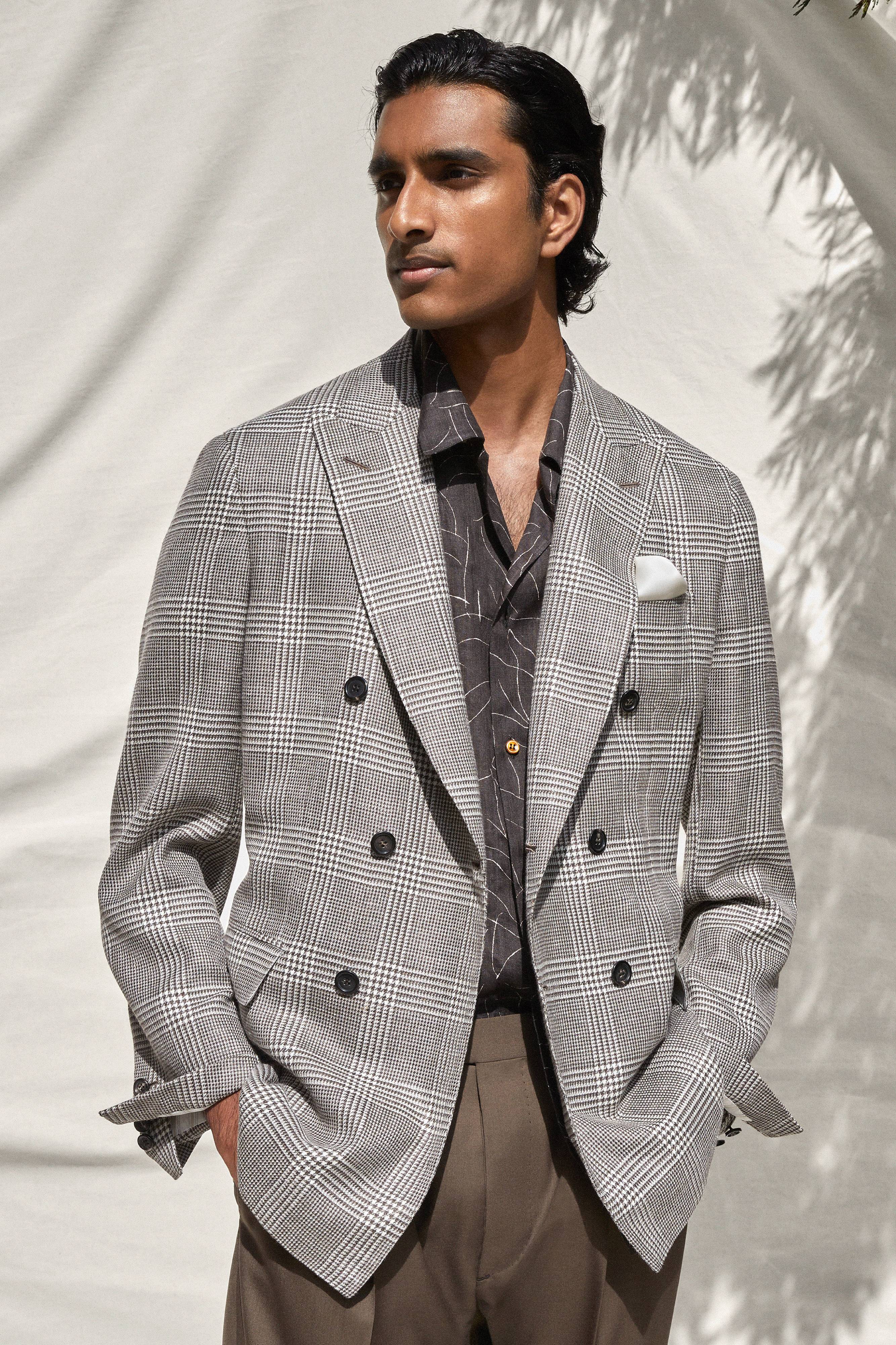 Brioni model wearing grey checked formal jacket from ss22
