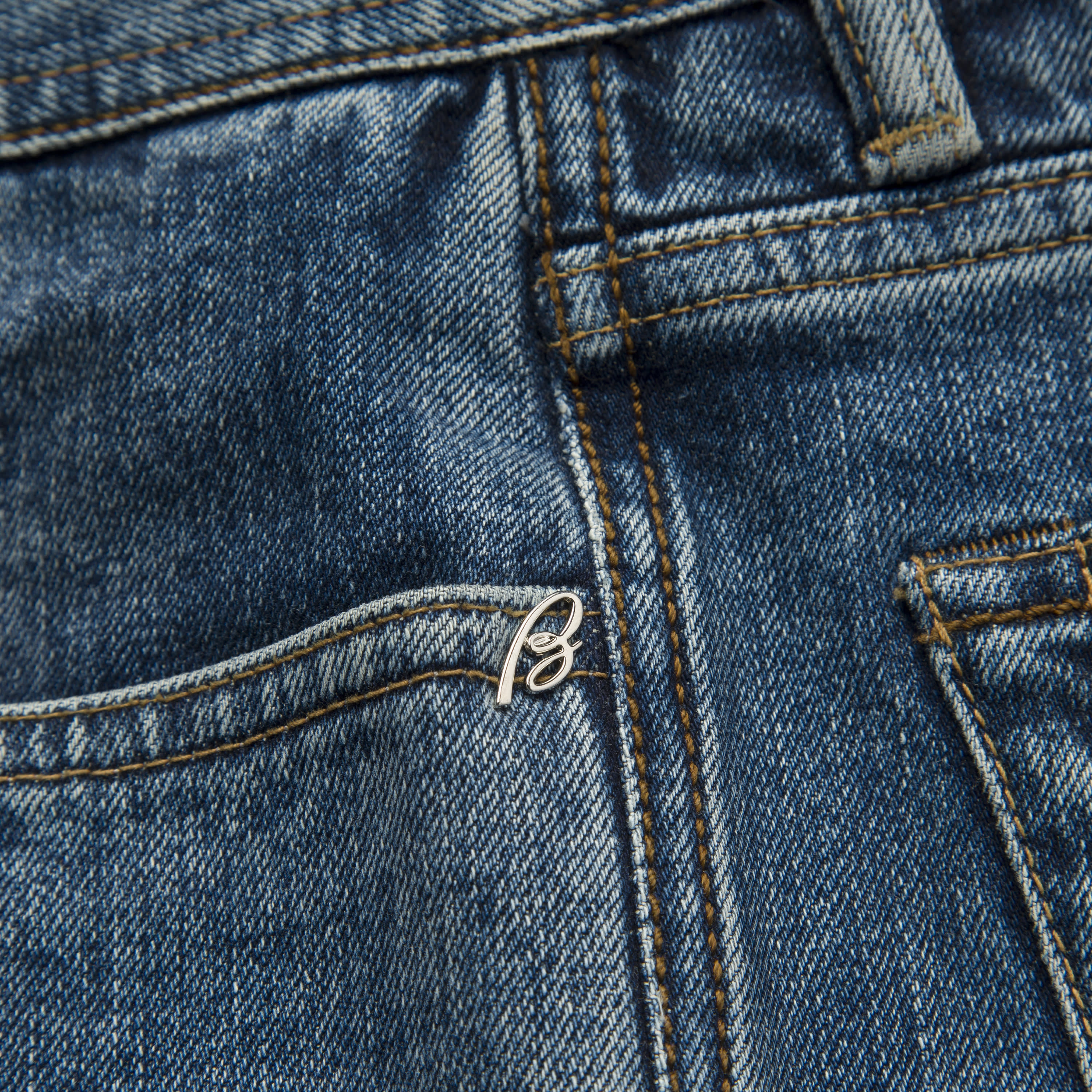 Brioni logo on jeans close up