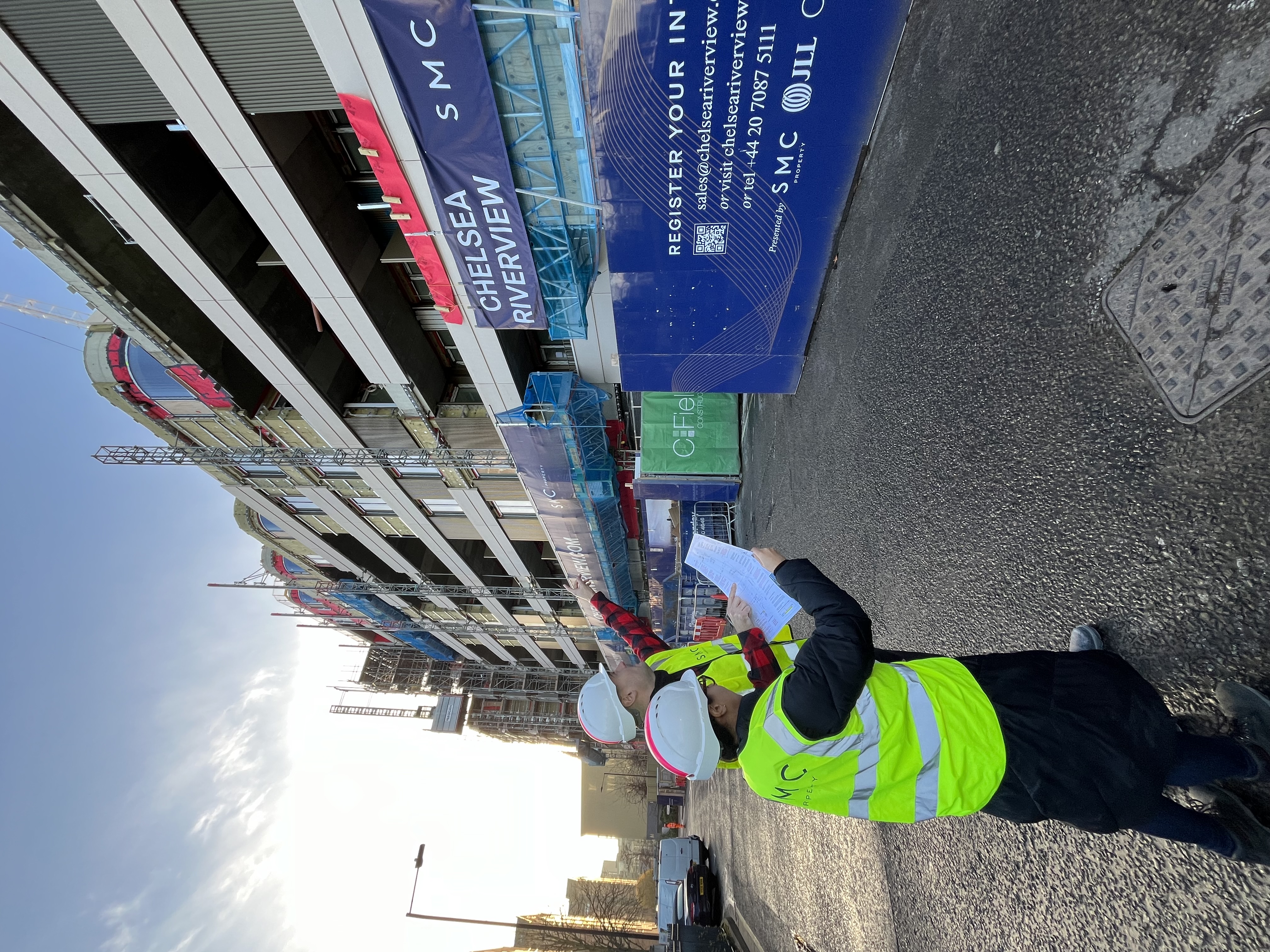 Architects Stephanie Stern and Vicente Cendoya reviewing the outside of the building