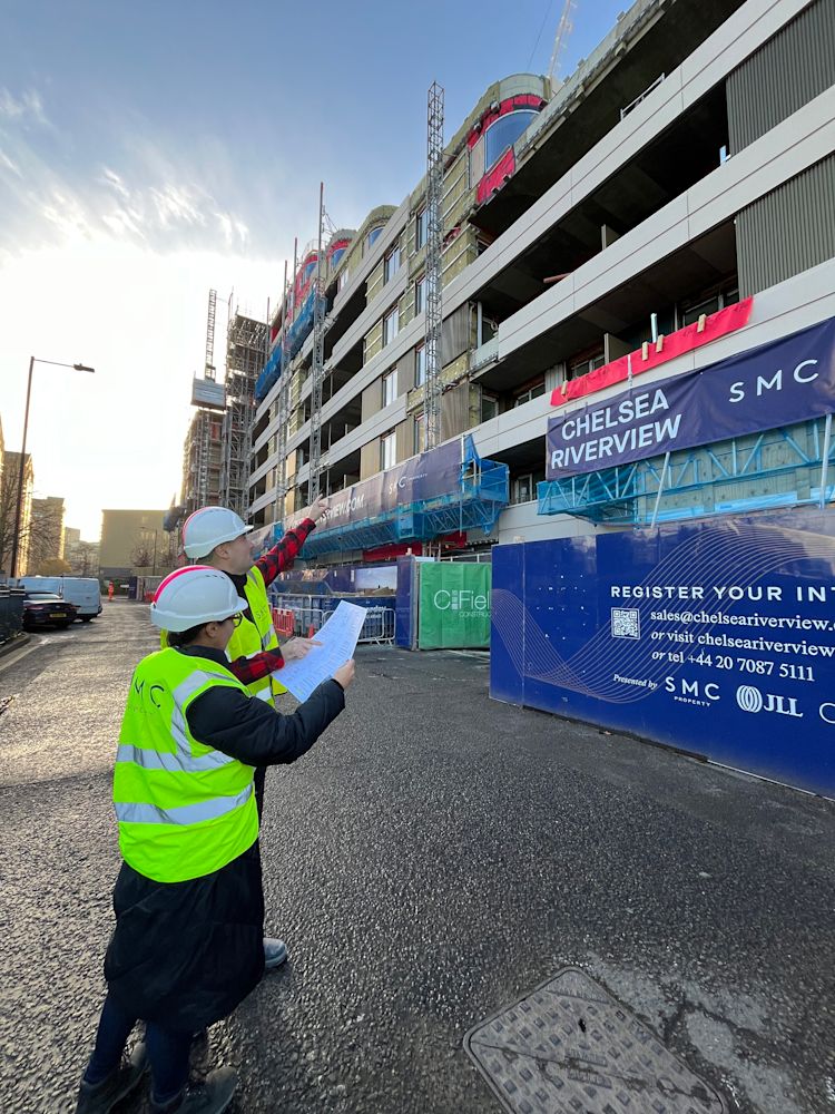 Architects Stephanie Stern and Vicente Cendoya reviewing the outside of the building