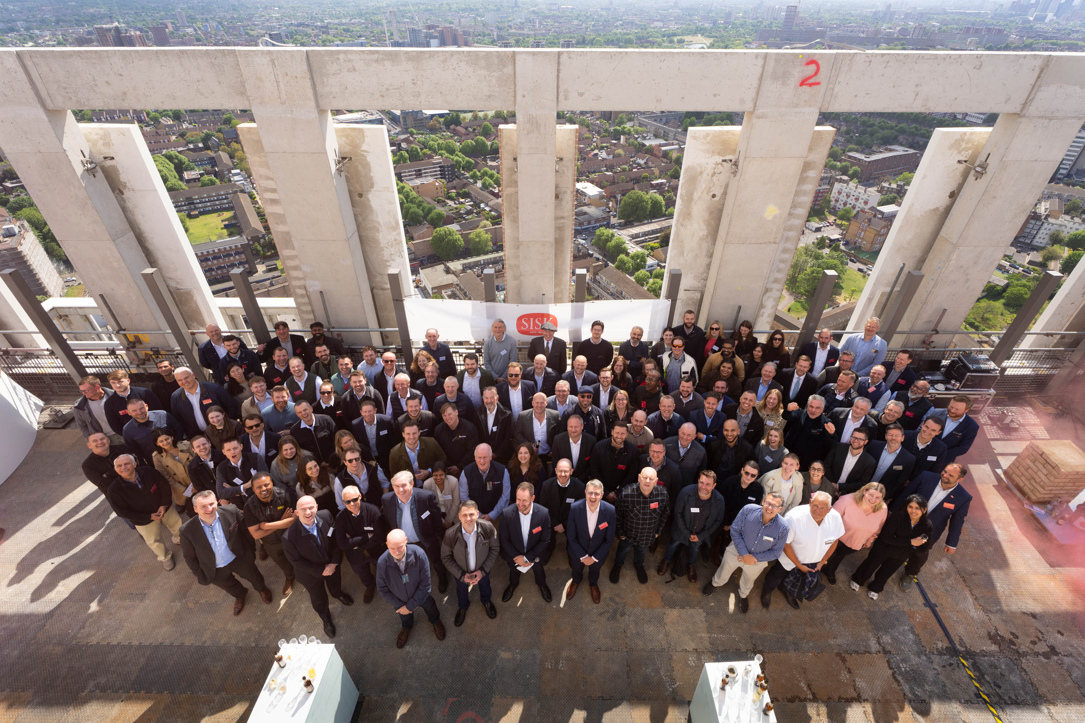 The team gathered for the topping out of Building ST