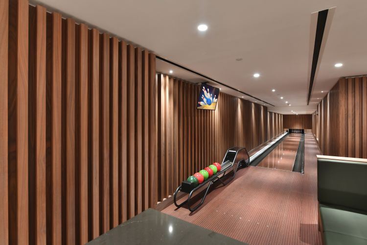 The integrated bowling alley is an included amenity for residents to use