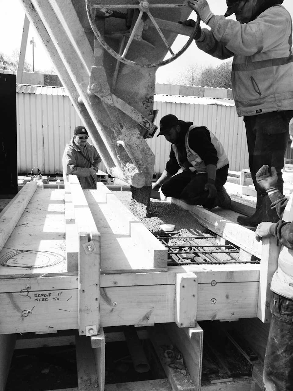 Pouring the concrete into the timber moulds