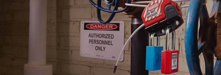 Two safety padlocks in a cable lock, in a factory setting