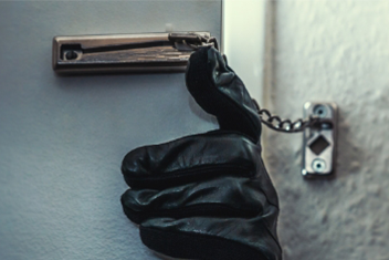 burglar opening a door latch