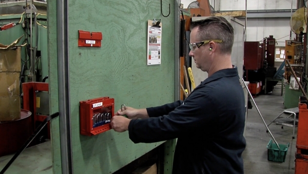 Worker operating a group lock box