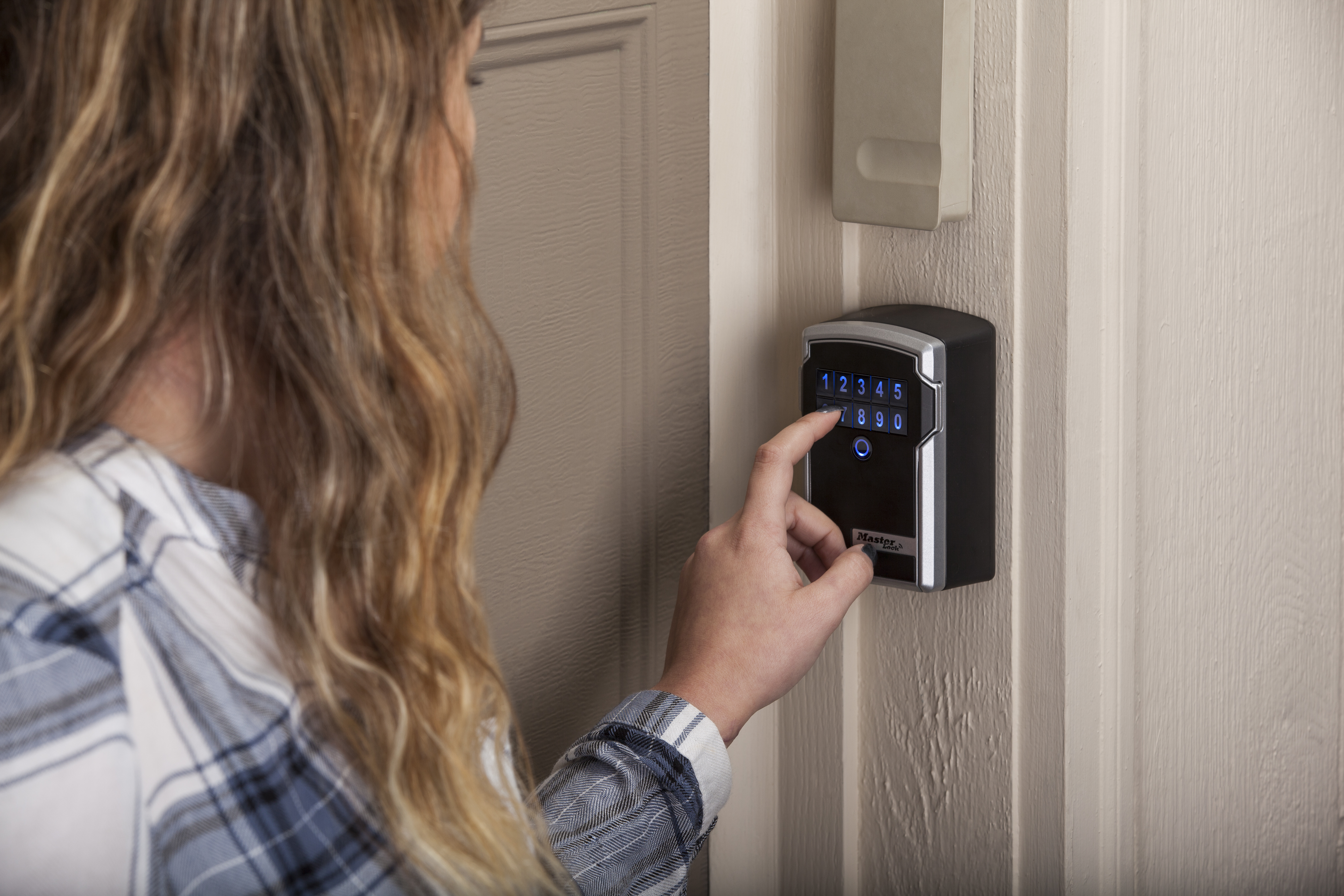 5441D Bluetooth Wall Mount Lock Box being used by a babysitter