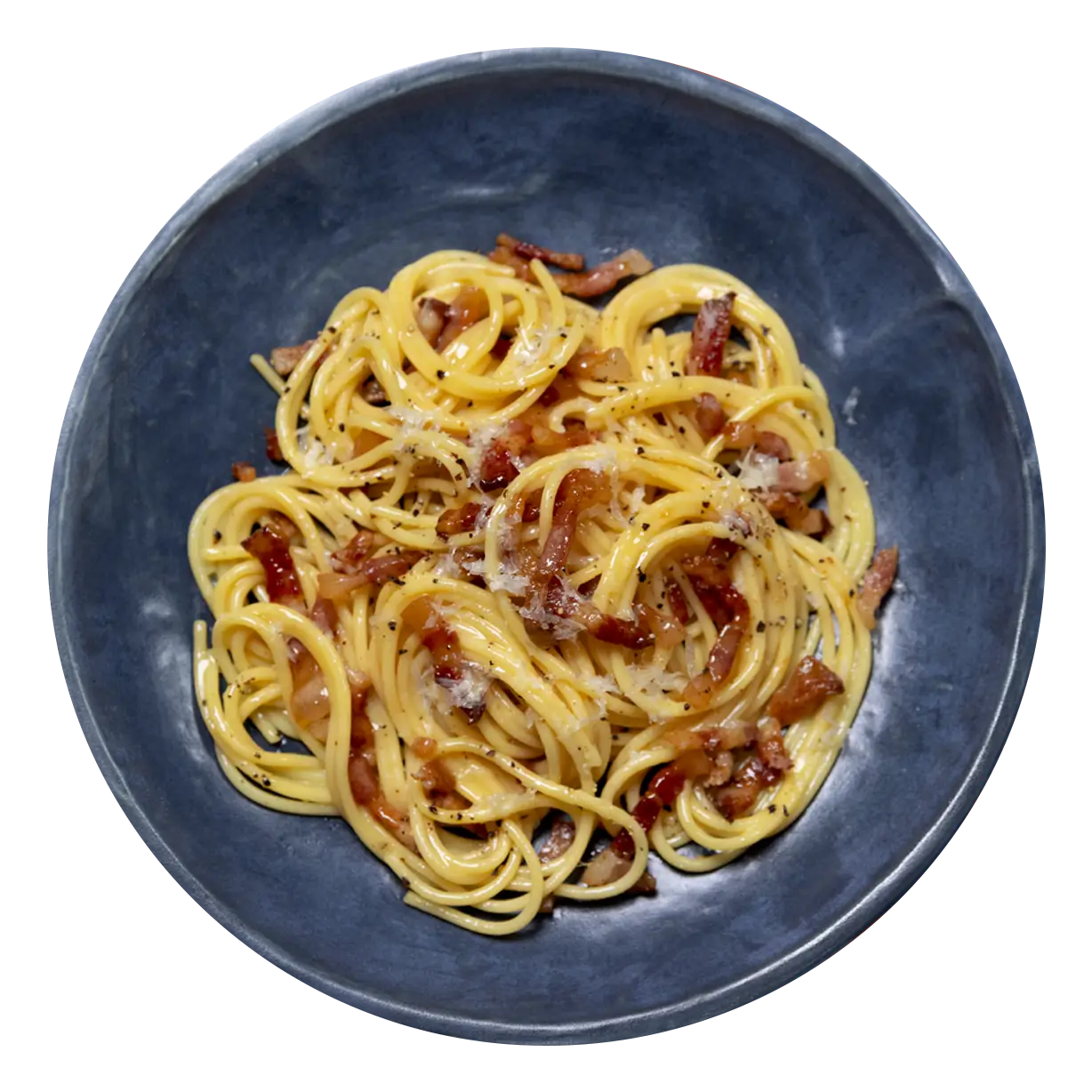 Carbonara sprinkled with cheese and pepper in a rustic blue bowl.