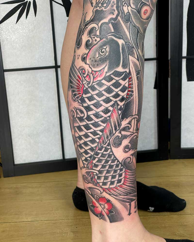 Japanese black and red koi fish tattoo 