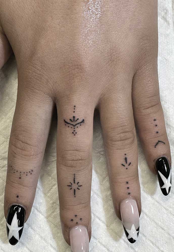 fineline finger tattoos