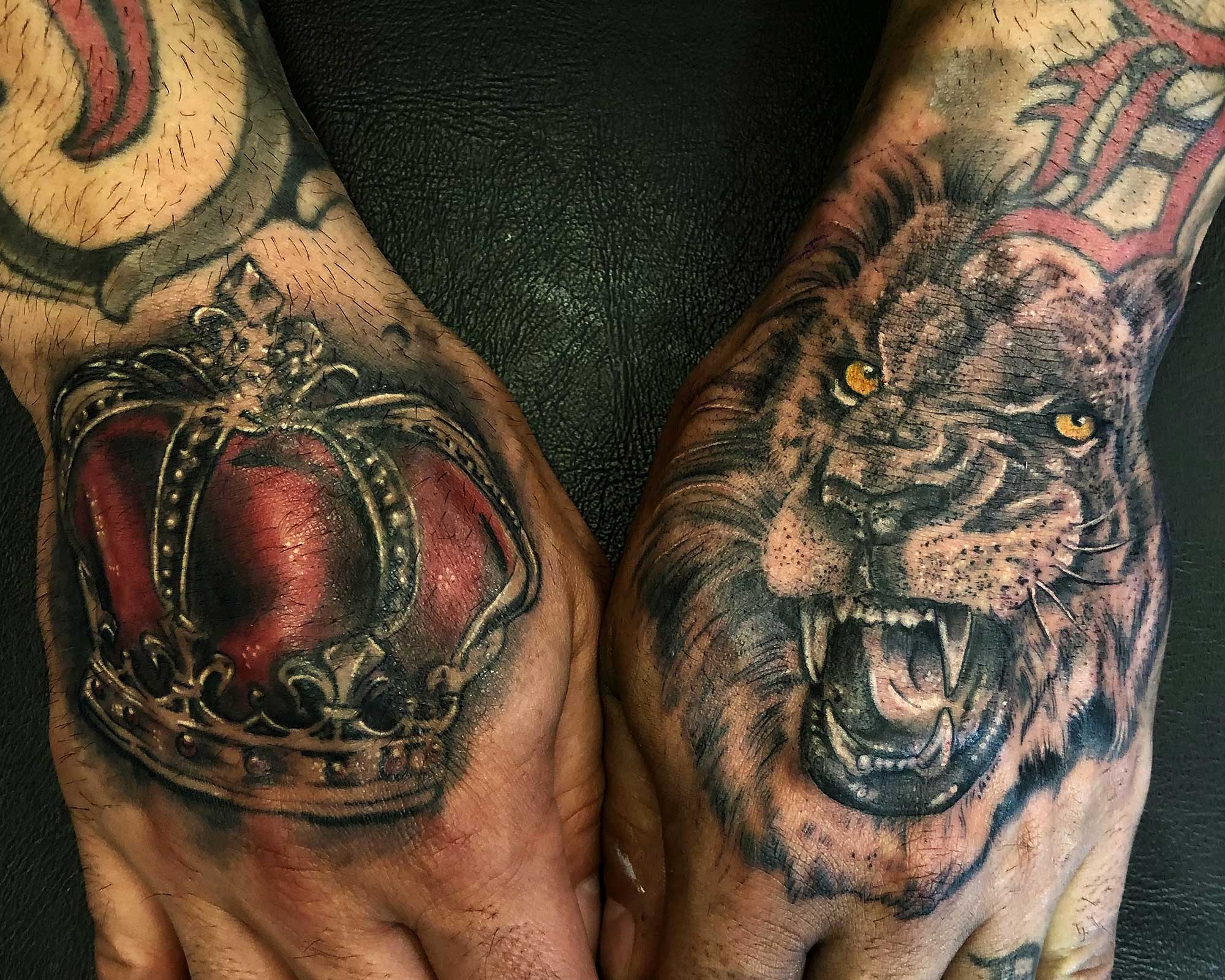 Lion and Crown Hand tattoo 
