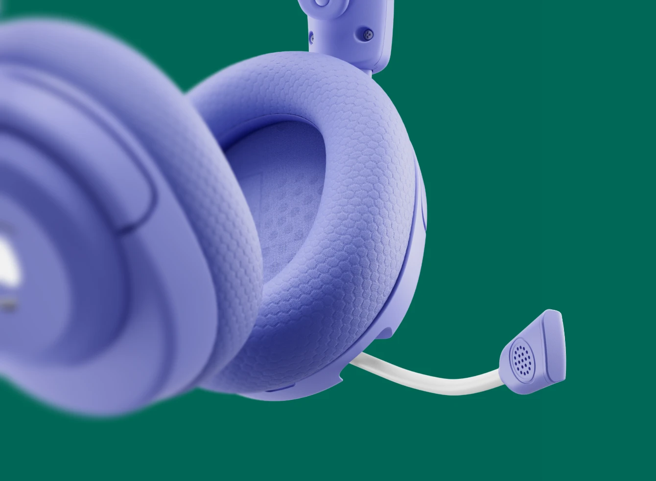 Close-up of the plush fabric ear cushion and retractable microphone of the purple Arctis Nova 5 Wireless South Park special edition gaming headset.