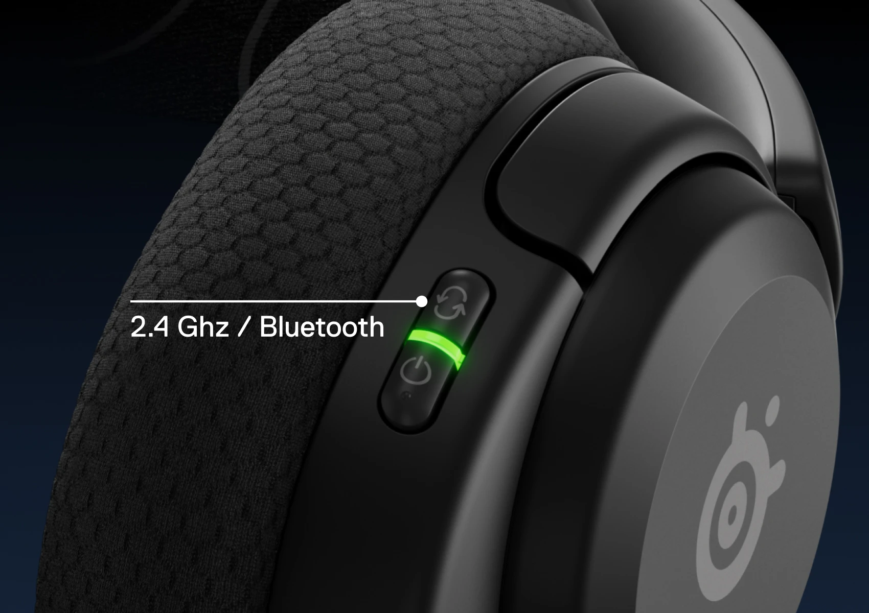 View of a single Arctis Nova 5 headphone, with visible side buttons for Bluetooth and 2.4 GHz options.