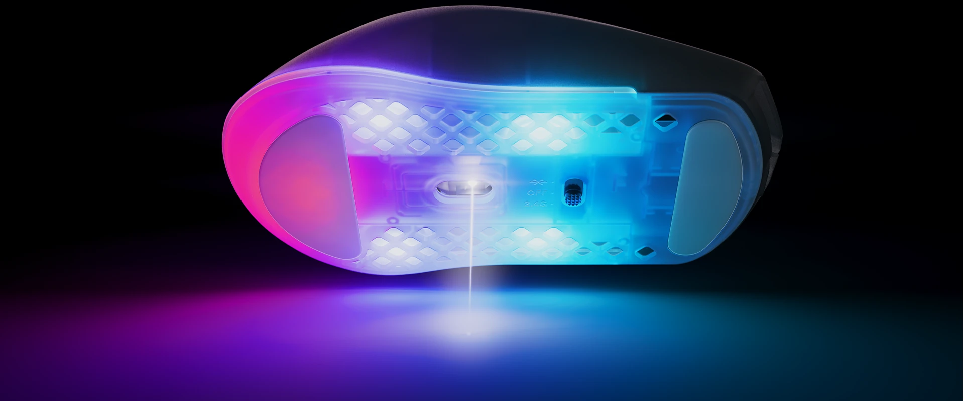 Bottom of RGB mouse emitting laser beam onto surface in pink and blue lighting.
