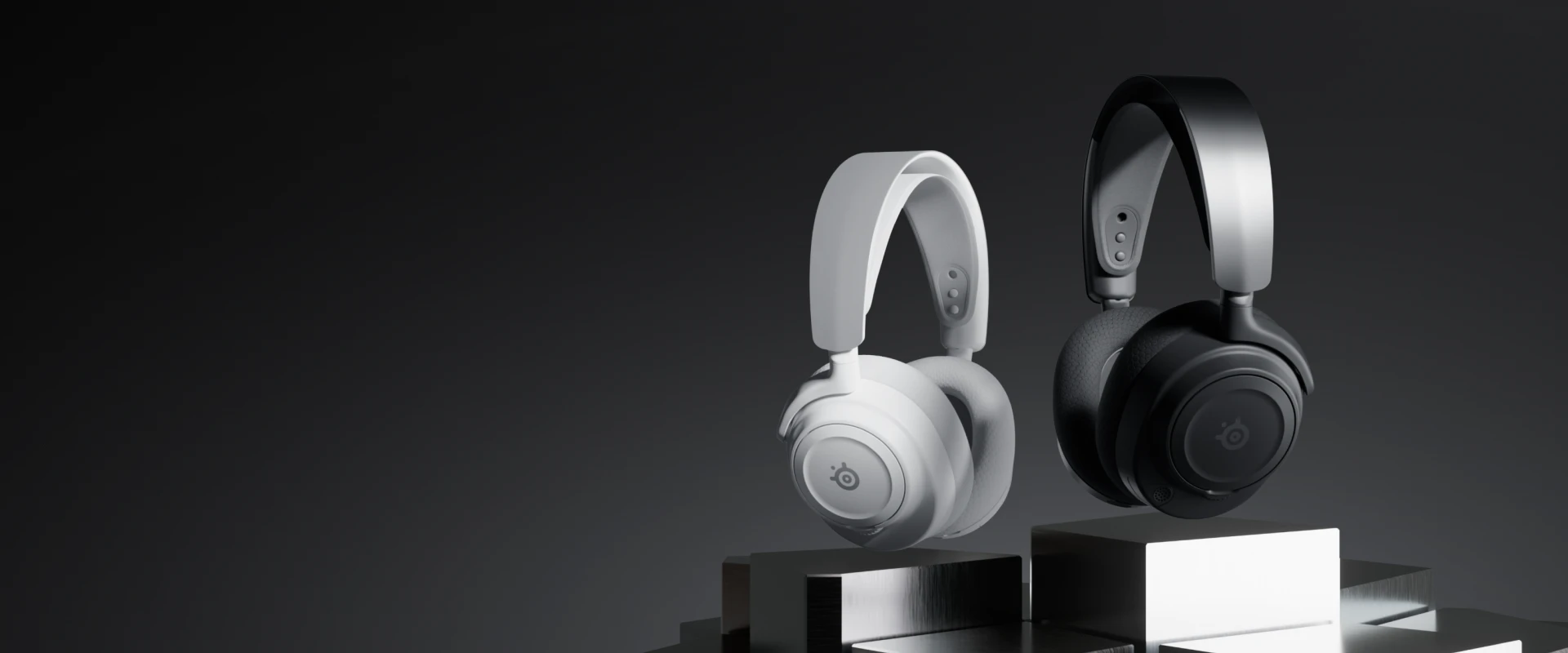 Arctis Nova 7 Gen 2 headphones in two color versions: black and white on a dark background. 