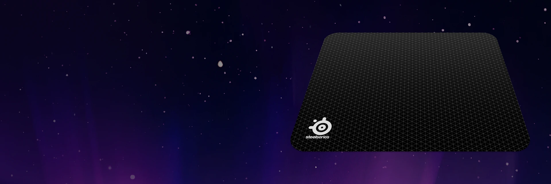 QCK M mousepad on a purple background