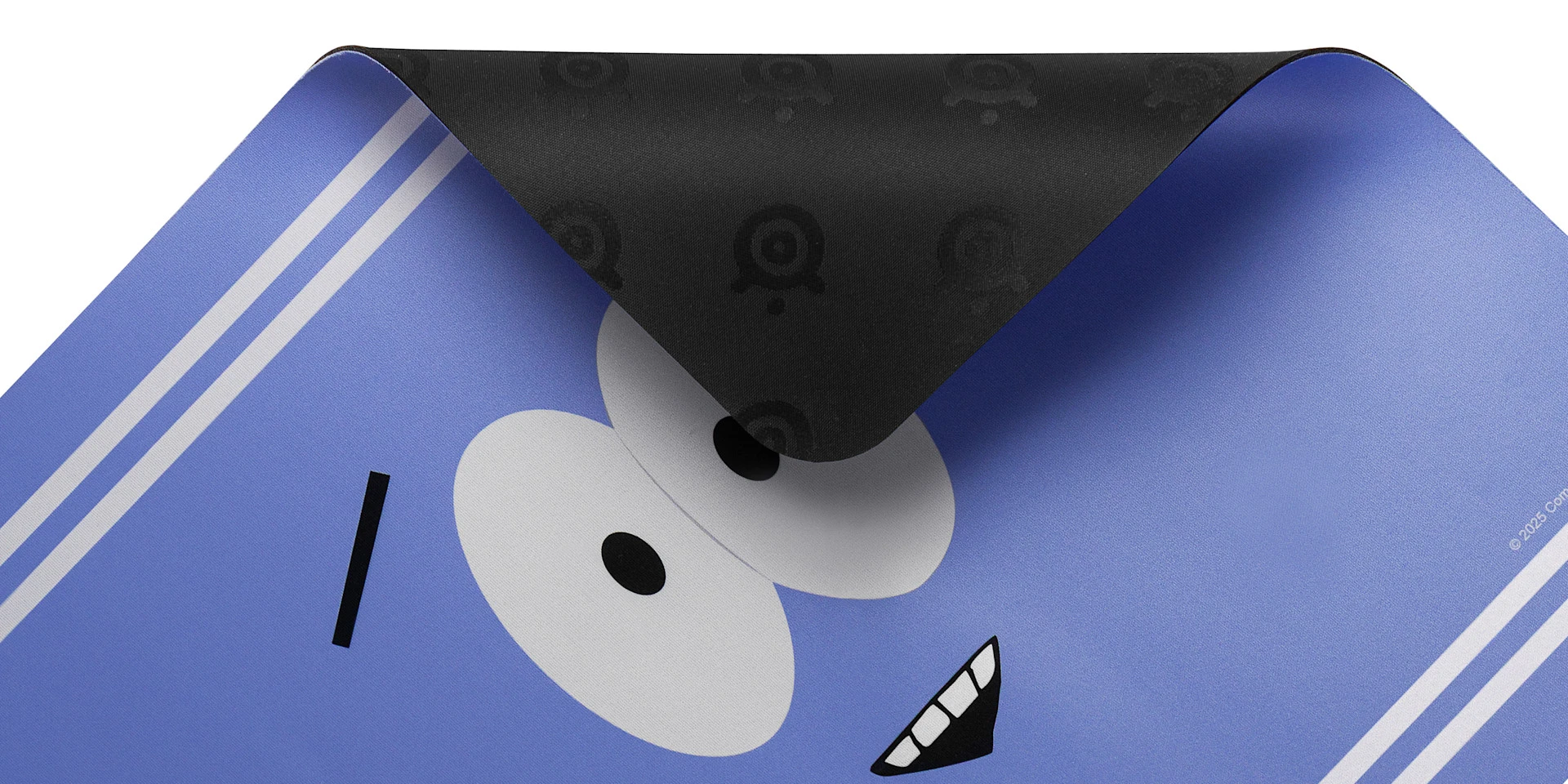 Close-up of the SteelSeries Towelie special edition gaming mousepad showing a corner folded over to highlight the textured, non-slip black rubber base against the purple cloth surface.