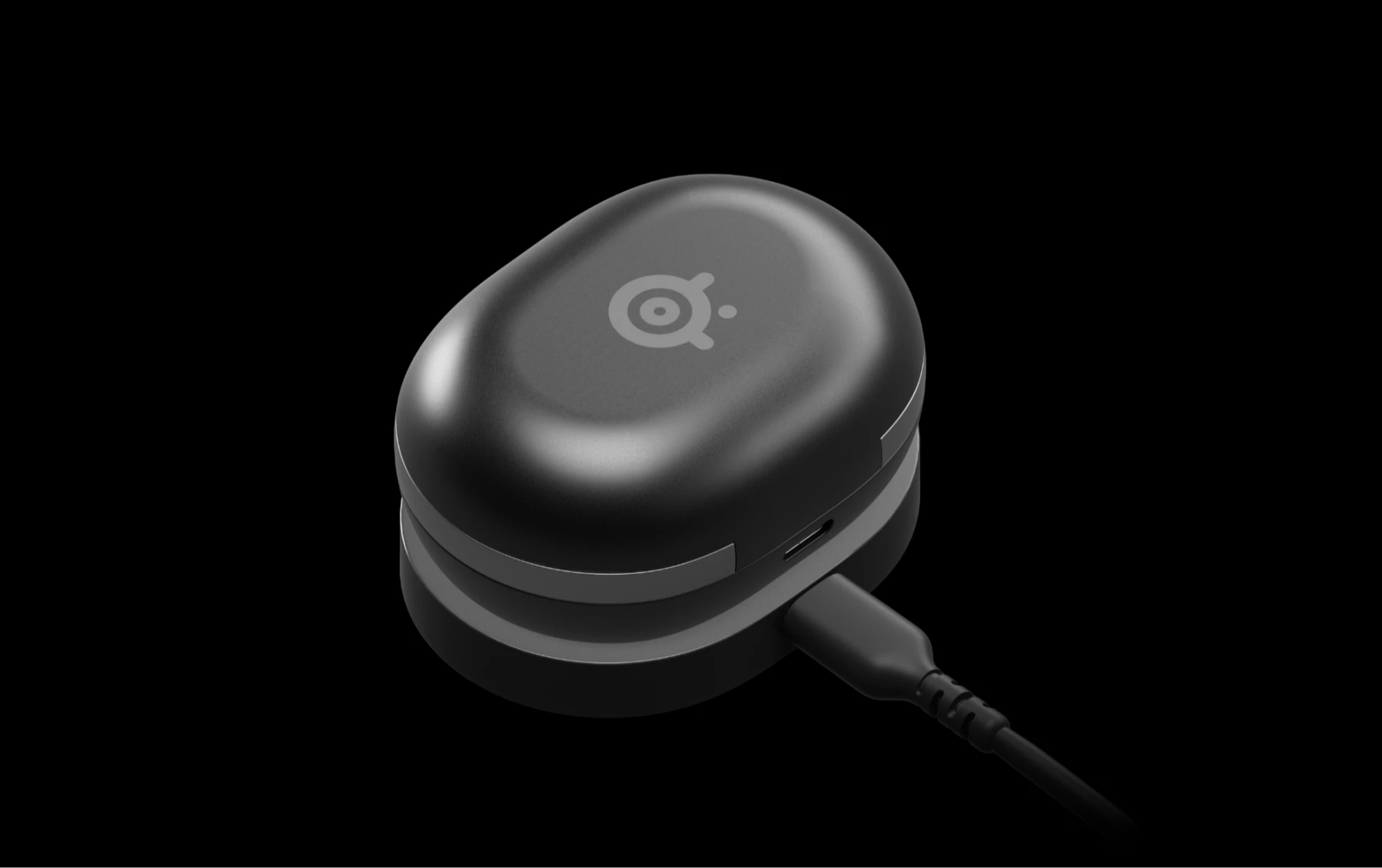 Un bo negro de arctis gamebuds sobre fondo negro.