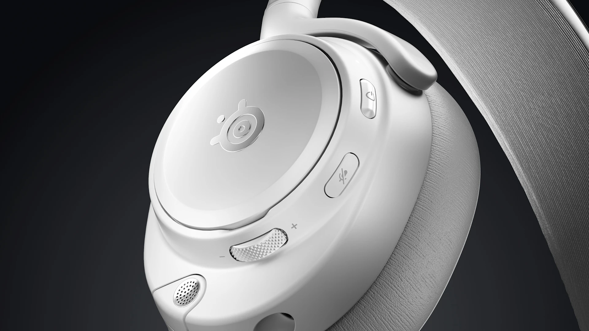 Close-up side view of white Arctis Nova Pro Wireless earcup showing SteelSeries logo, mute button, volume wheel, and ANC microphone ports.
