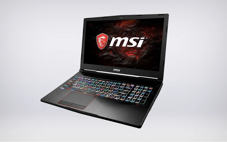 A black MSI gaming laptop is displayed at an angle, showcasing its colorful rainbow-backlit keyboard and the MSI logo on the screen.