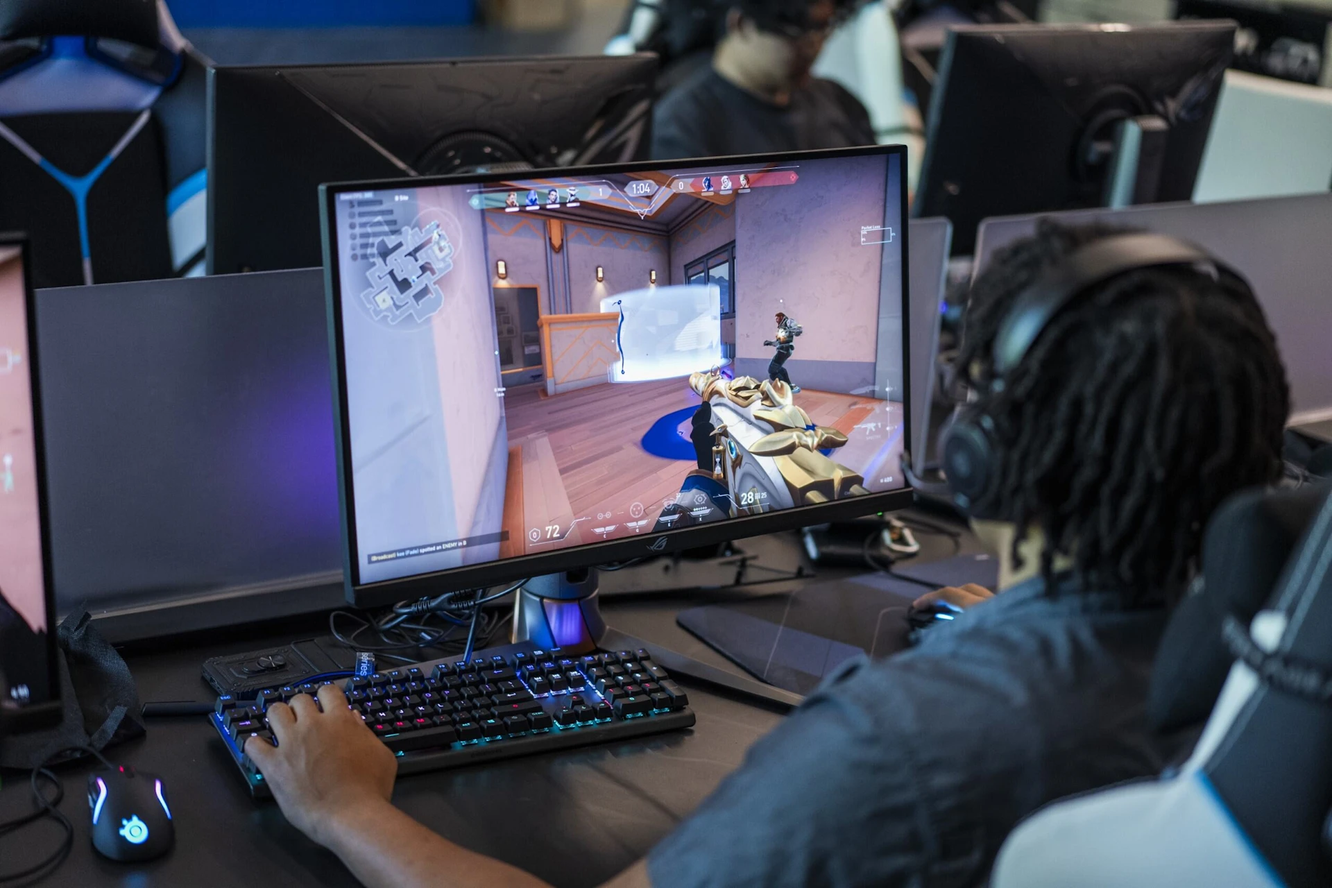 A person sitting on gaming chair and focusing playing games.