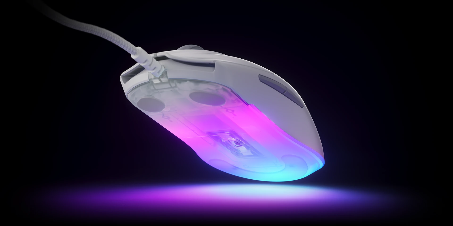 The mouse is slightly lifted, revealing its richly illuminated underside