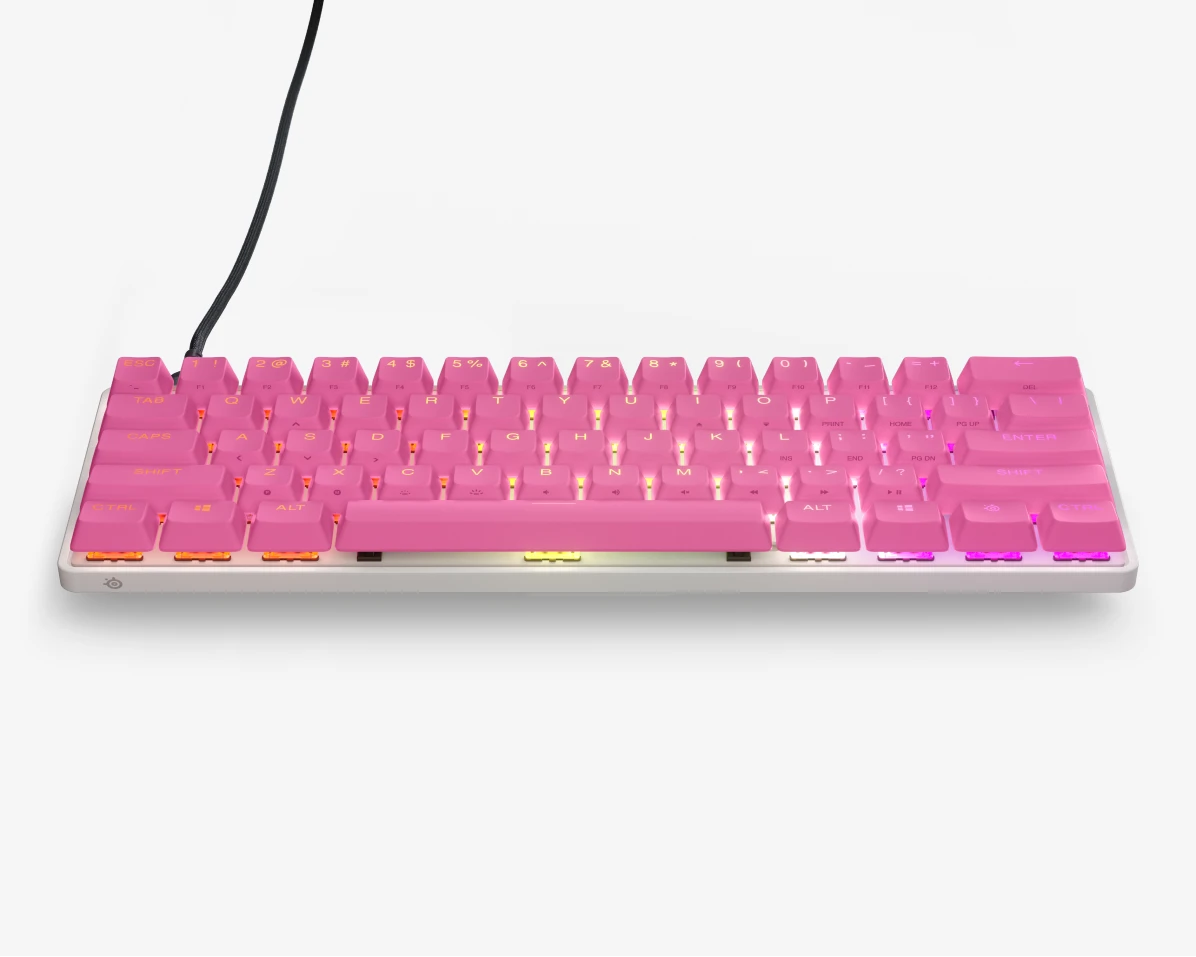 A photo of pink keycaps on white keyboard.
