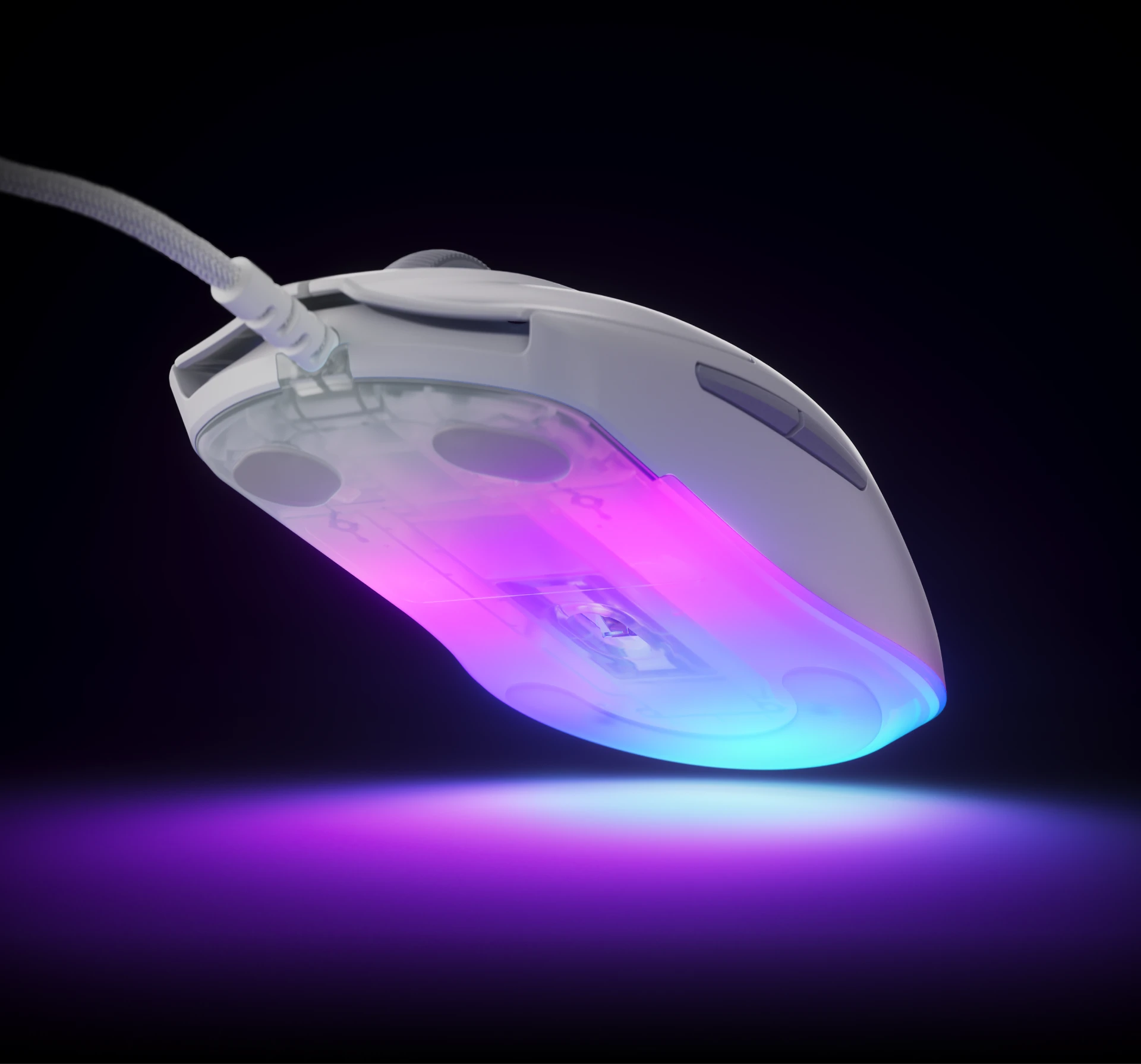 The mouse is slightly lifted, revealing its richly illuminated underside