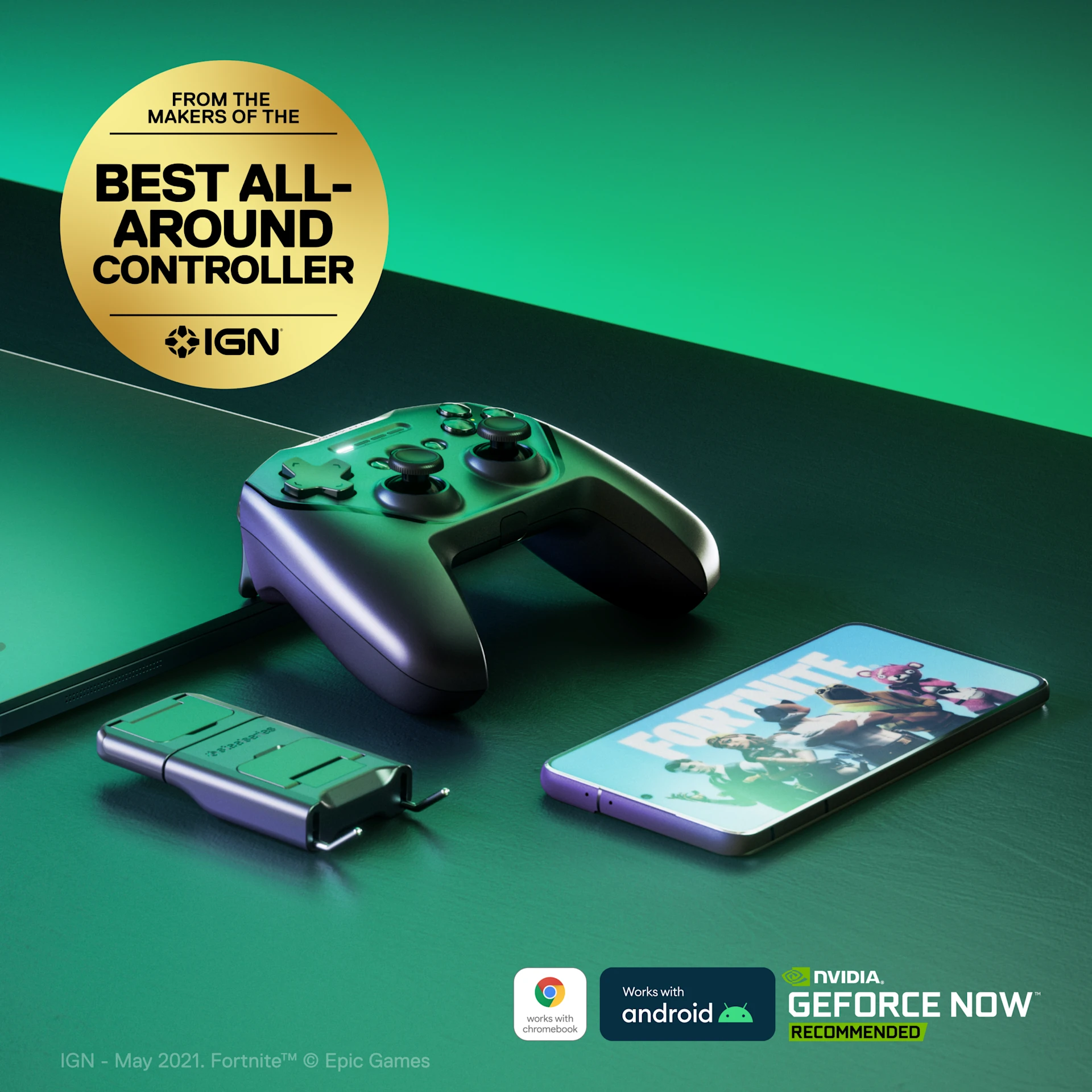 Stratus plus gaming controller laying on the table with battery and phone laying next to it, all with light green illumination surrounding the image.