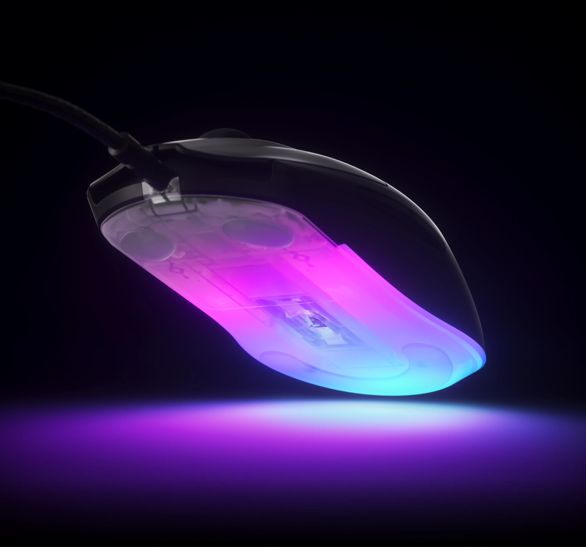 The mouse is slightly lifted, revealing its richly illuminated underside.
