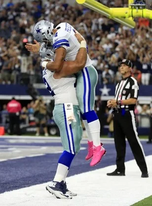 Two athletes hugging. 