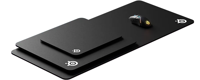 qck mouse pads stacked on top of each other