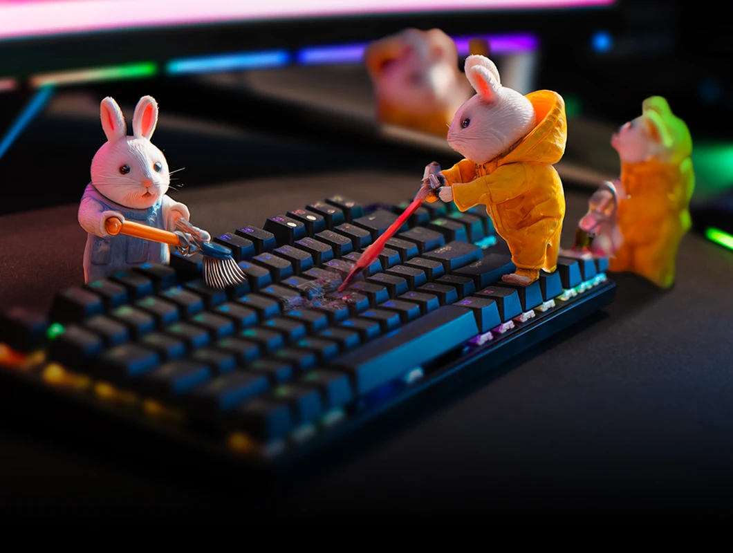 An image of bunnies cleaning an Apex keyboard and mouse.