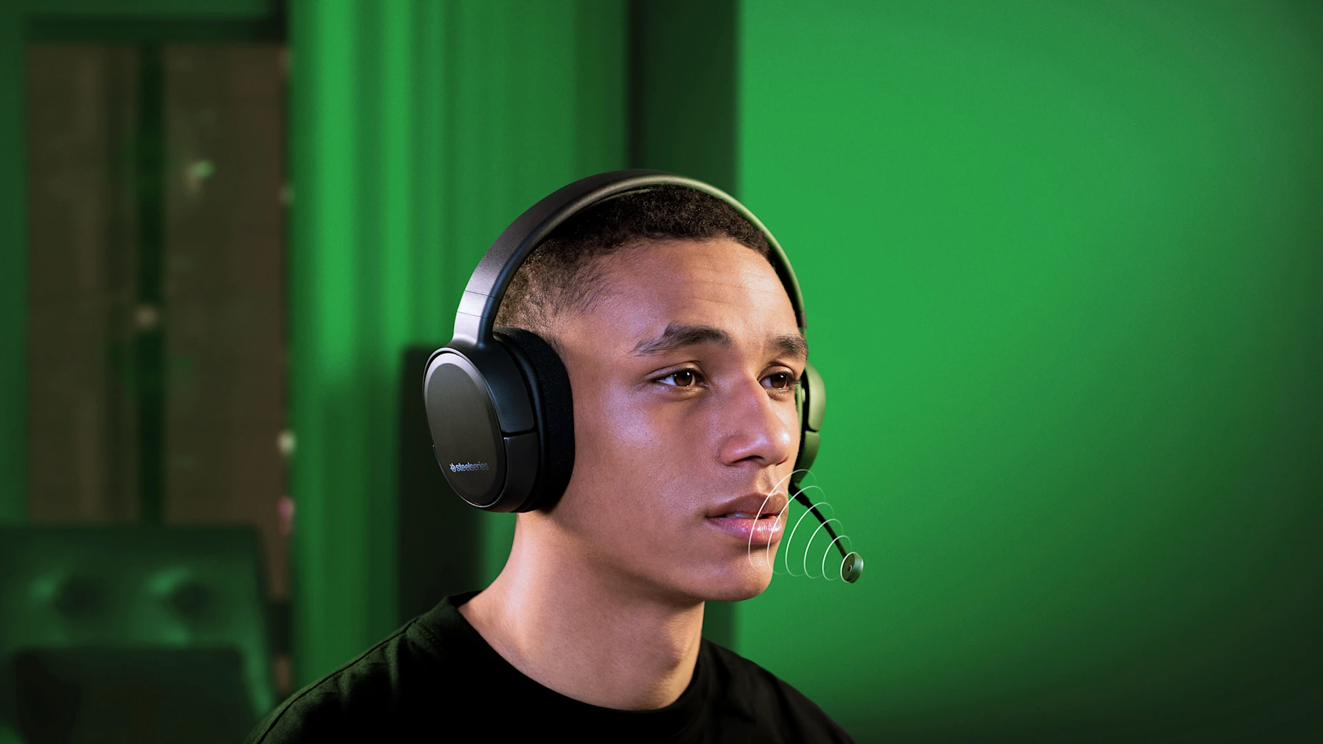 person talking to other people using Arctis 1 headset
