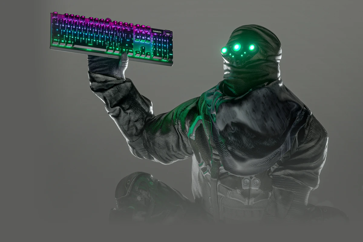 An image of a character holding an Apex keyboard with a grey gradient background.