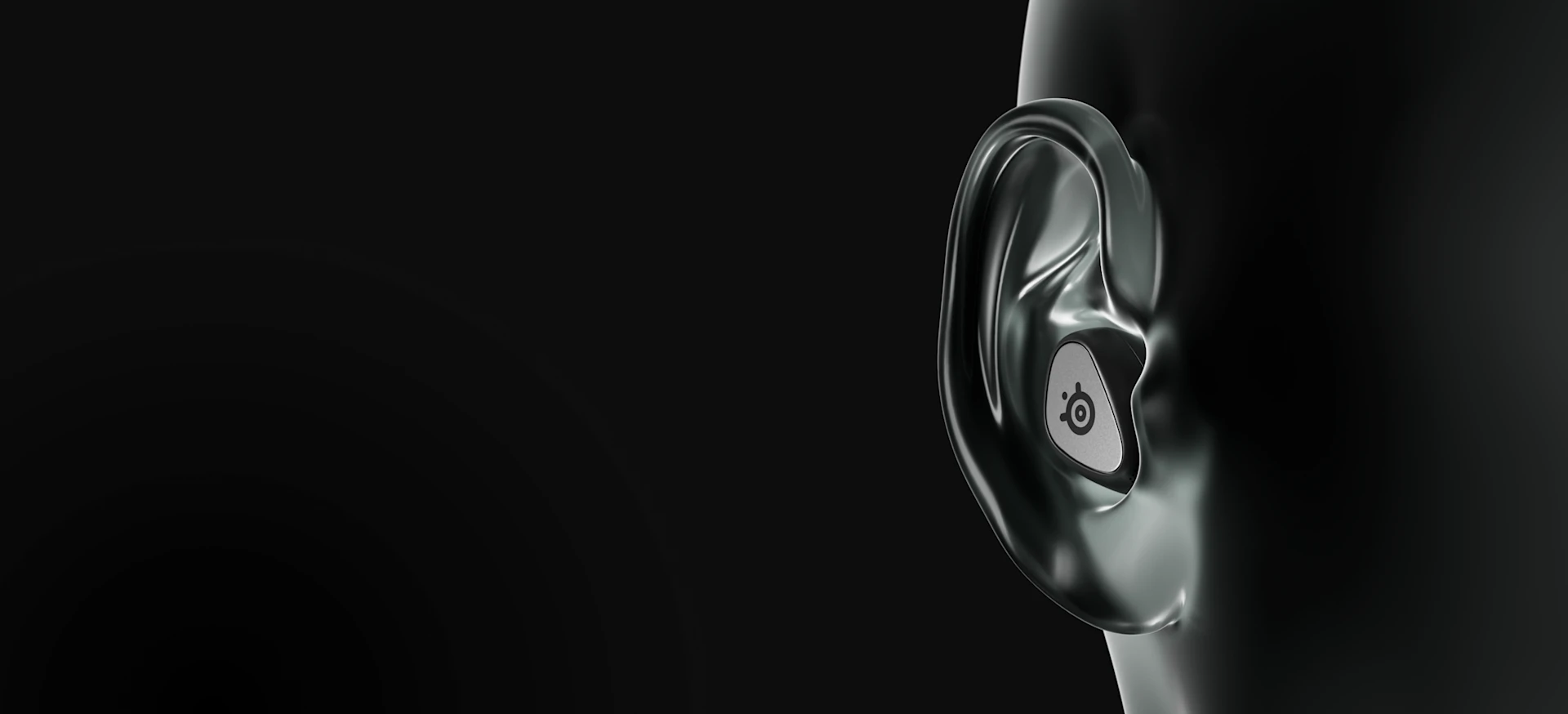 Visible large ear of the mannequin with a black Arctis Gamebuds headset.