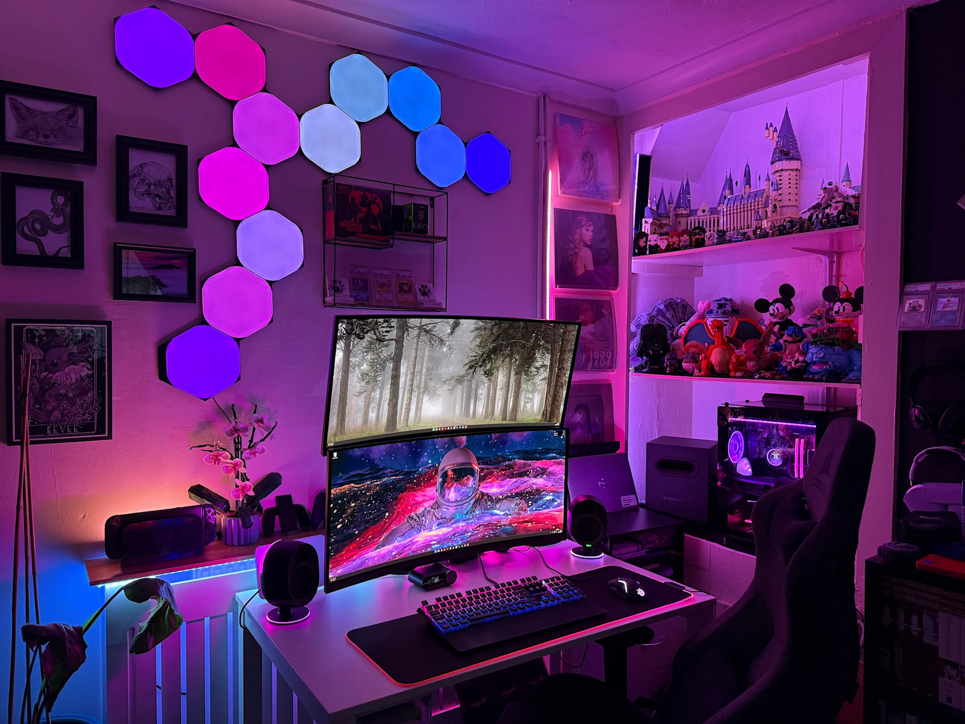 a dual curved screen gaming Setup with Pink to Blue RGB Lightnings featuring SteelSeries Devices