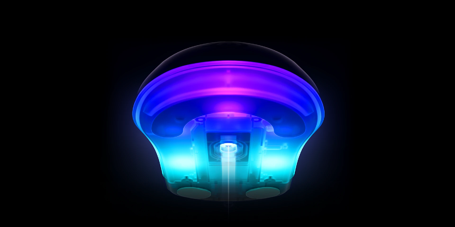 The bottom part of the mouse is glowing with a bluish color, with a sensor in the middle.