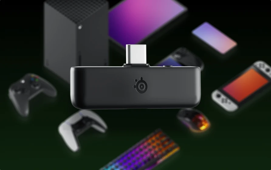 Dongle for Arctis Nova 5 black;in the background visible different devices that are compatible with the dongle.