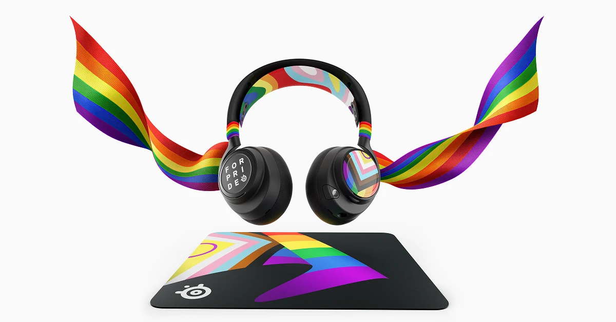 SteelSeries Pride Edition 游戏耳机与鼠标垫,饰有飘逸的彩虹丝带。