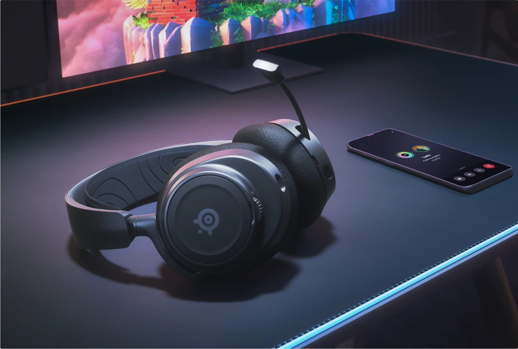 A black SteelSeries gaming headset on a desk, illustrating simultaneous game audio and a mobile call via Bluetooth.
