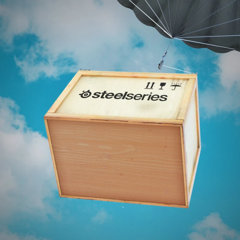 A SteelSeries loot box descending from the sky with a parachute.