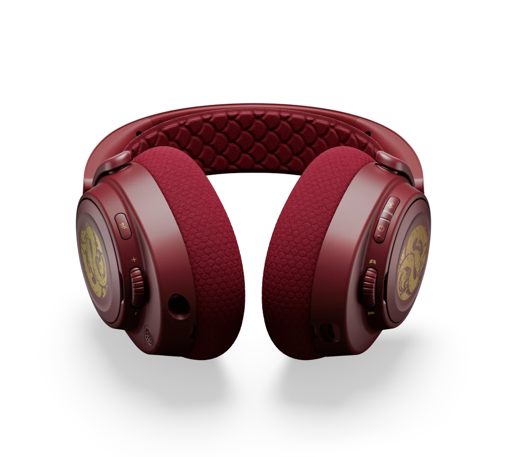 An Arctis Nova 7 Dragon edition laying on its side, exposing the onboard control dials and buttons.