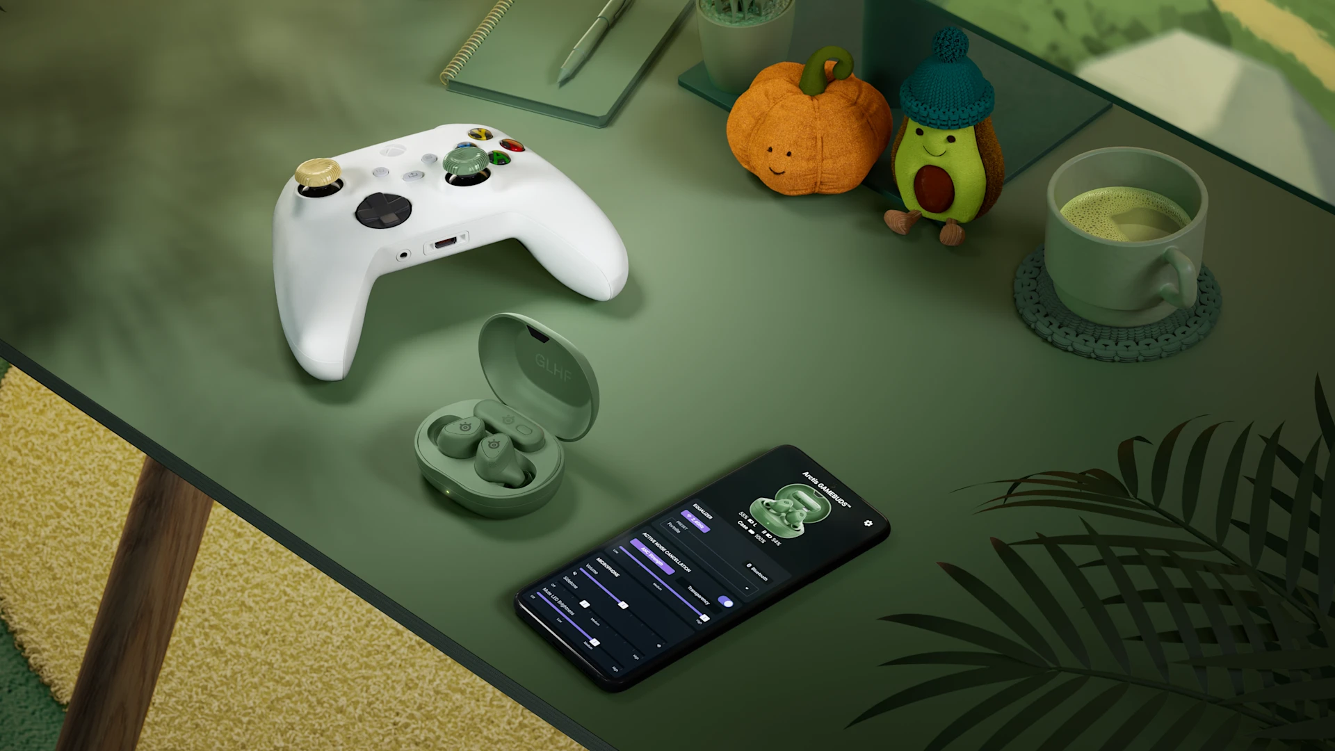 SteelSeries Arctis GameBuds in Matcha Green next to an Xbox controller and a mobile companion app on a desk setup.